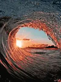 Sunset inside a curling wave