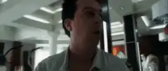 Man puts on glasses and stares blankly