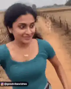 Woman running and smiling at camera