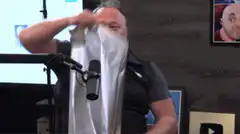 man puts on aluminum foil hat