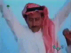 Arab man dancing with arms raised