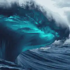 Giant turquoise ocean wave crashing