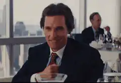 Gordon Gekko smirking and nodding