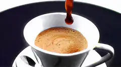 Coffee being poured into a cup