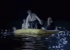 Man falls off yellow raft into water
