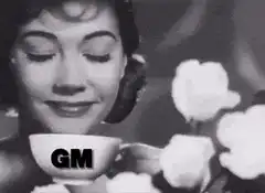Woman drinking tea with GM text and red eyes