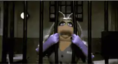 Miss Piggy in prison looking shocked