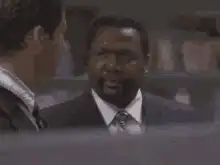 Dennis Haysbert looking down