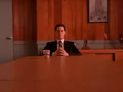 Agent Cooper sitting at a table