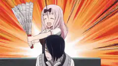 Chika Fujiwara hits Maki Nakayama with a fan