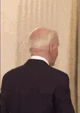 Joe Biden turns around smiling