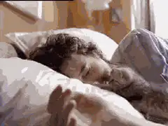 person sleeping with cat