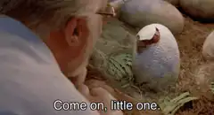 John Hammond hatching dinosaur egg