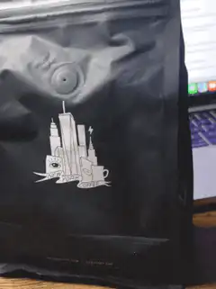 black coffee bag with city skyline logo