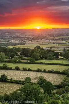 sunset over patchwork fields