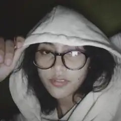 girl in hoodie and glasses