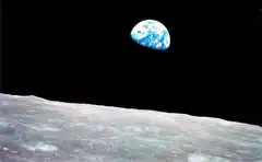 Earth rising over the moon