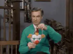 Mr. Rogers puts on a clown mask