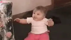 Baby excitedly reaches for ice cream