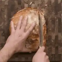 slicing a loaf of bread