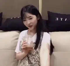 Woman drinking and giving thumbs up