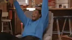 Man throws laptop and falls back in chair