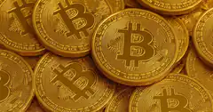 pile of physical bitcoin coins