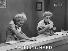 Two women working hard at a counter