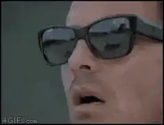 Man puts on second pair of sunglasses