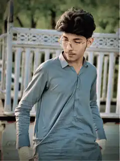 Young man in blue kurta and glasses
