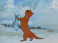 Otter holding fish in snow