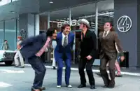 Four men jumping in celebration