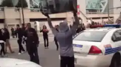 Man smashes police car with TV