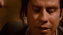 John Travolta and Kristen Wiig crying