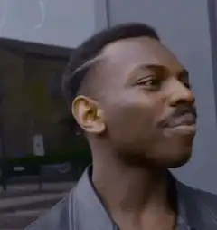 Man taps his head thinking