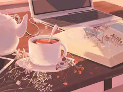cozy desk with tea and laptop