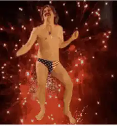 Man in American Flag Speedo Dancing with Fireworks