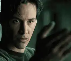 Neo touches the glass in The Matrix
