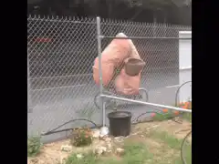 person in pink sleeping bag riding bike