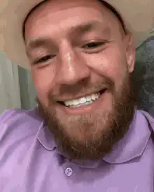 Conor McGregor smiling and giving a thumbs up