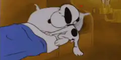 Snoopy sleeping in bed