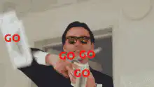 Man in sunglasses drinking with go go text