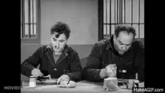 Charlie Chaplin and Henry Bergman eating soup