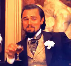 Leonardo DiCaprio raising a glass