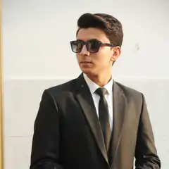 Man in suit and sunglasses