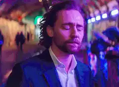 Tom Hiddleston nodding with eyes closed