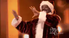 Snoop Dogg dancing as Santa Claus
