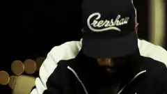 Man in Crenshaw hat looks up