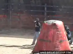 paintball player gets hit and falls