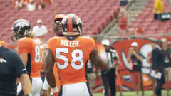 Von Miller and teammate on field